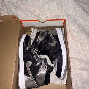 Nike Women’s Jordan 1s Grey and Black Satin.